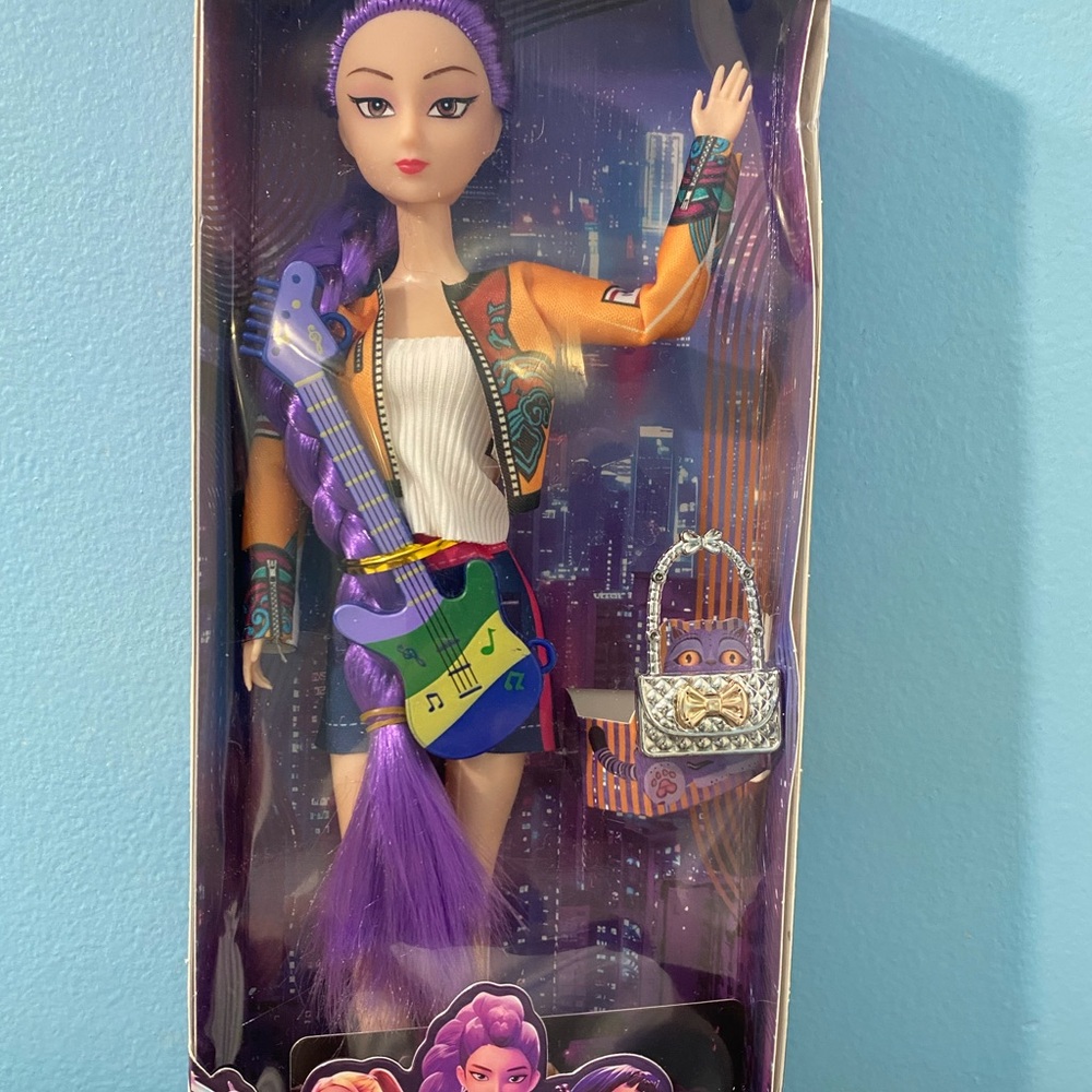 Stylish Doll with Purple Hair and Musical Accessories